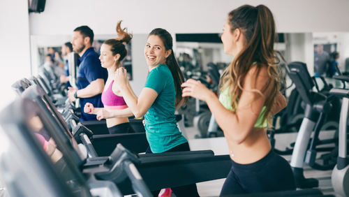 women running on treadmill